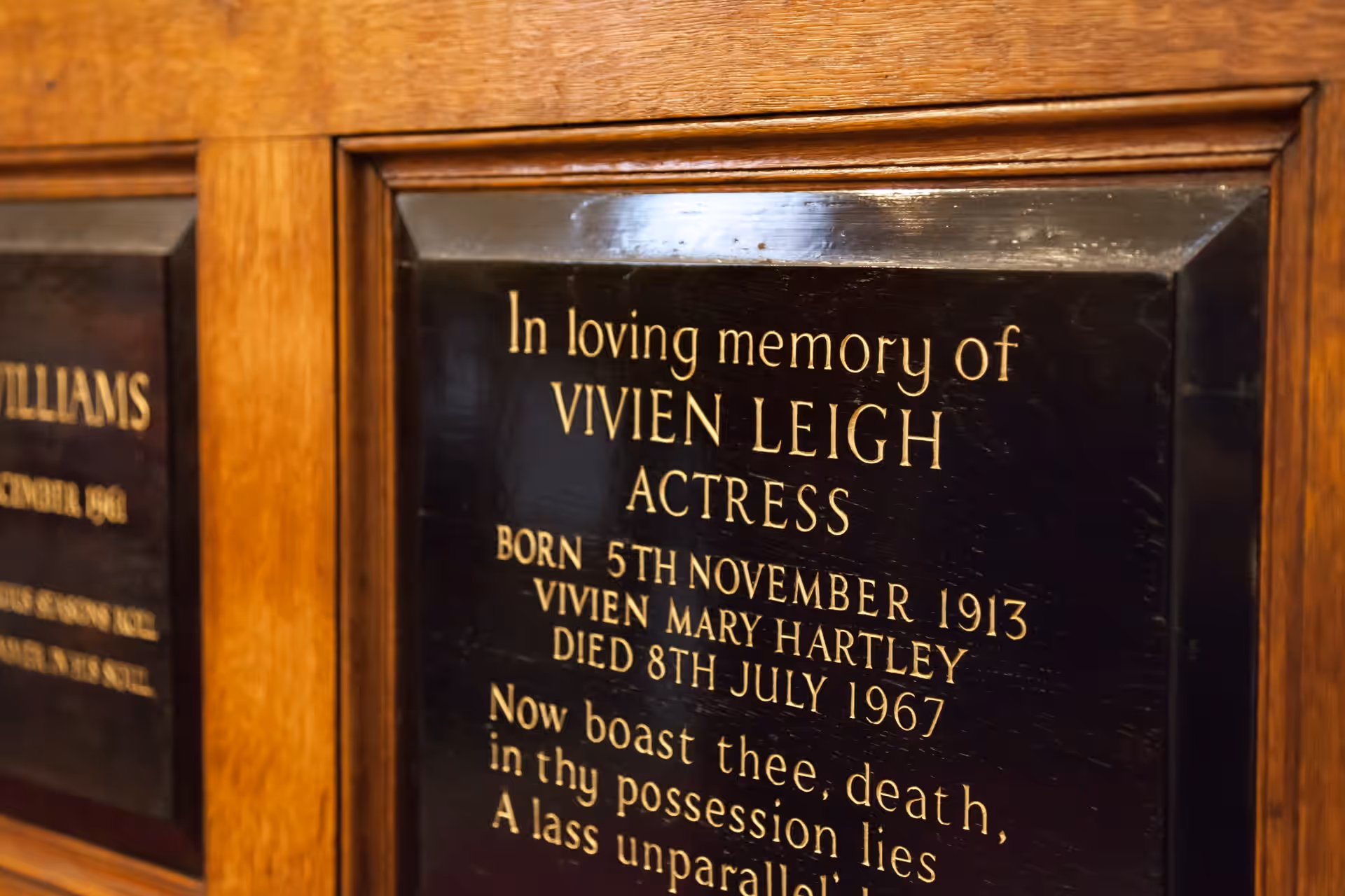 A black memorial plaque with gold lettering in loving memory of Vivien Leigh, actress, 1913 to 1967.